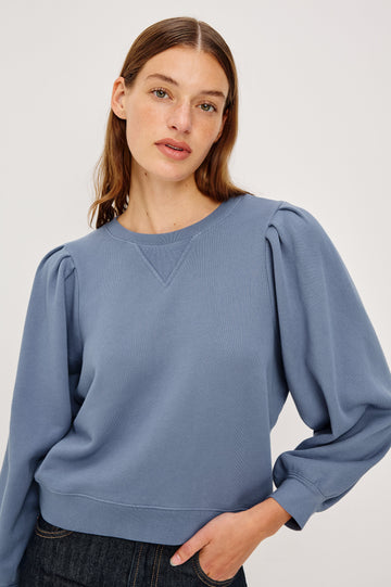 Tiffany Long-Sleeve Sweatshirt with a Crew Neck and Deep Pleated Sleeves in Faded Periwinkle Colorway - Close up View Featured on Model