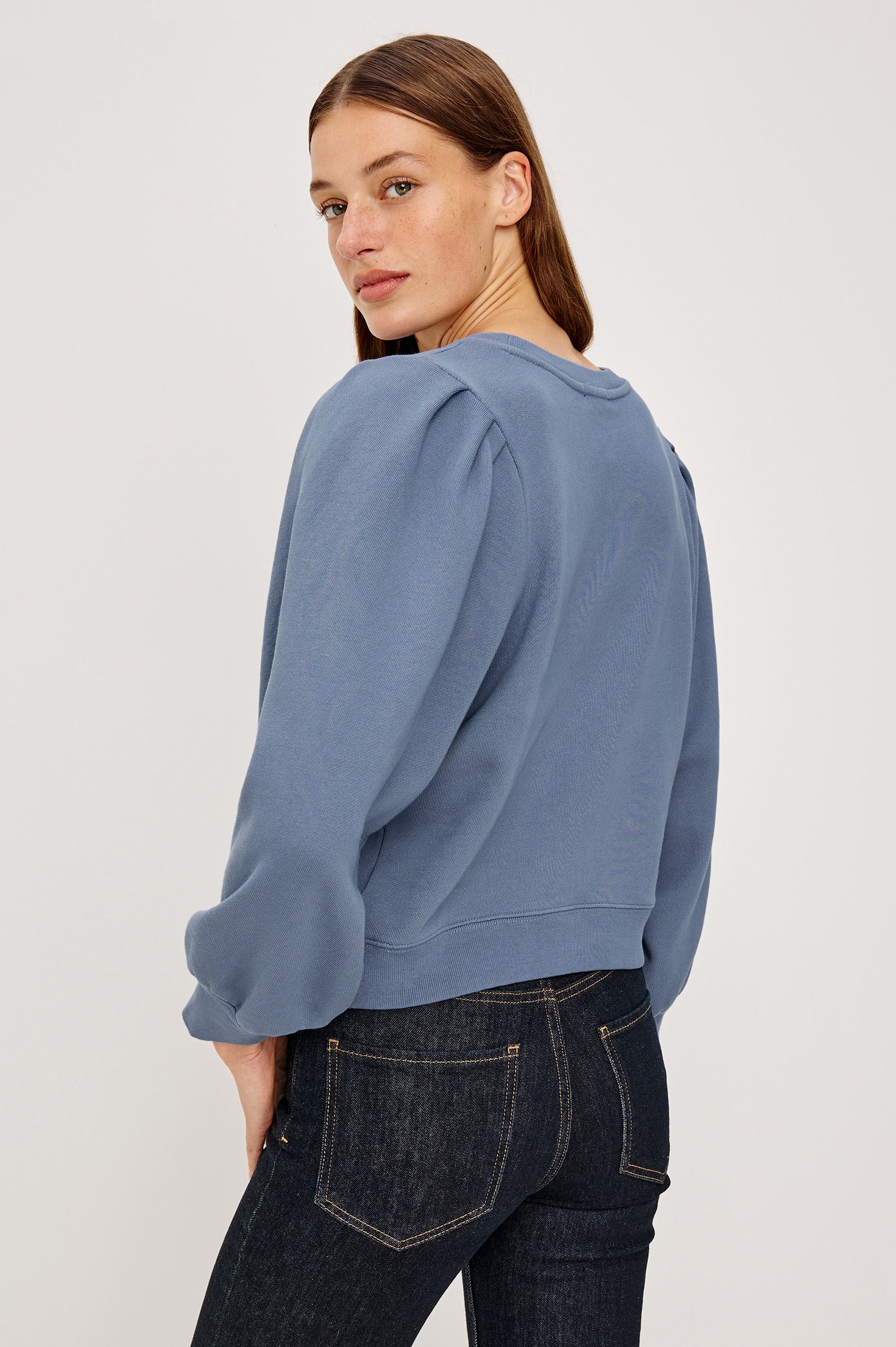 Tiffany Long-Sleeve Sweatshirt with a Crew Neck and Deep Pleated Sleeves in Faded Periwinkle Colorway - Back View Featured on Model