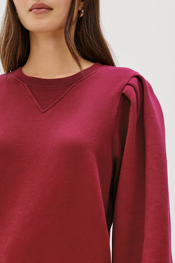 Tiffany Long-Sleeve Sweatshirt with a Crew Neck and Deep Pleated Sleeves in Merlot Colorway - Close Up View Featured on Model