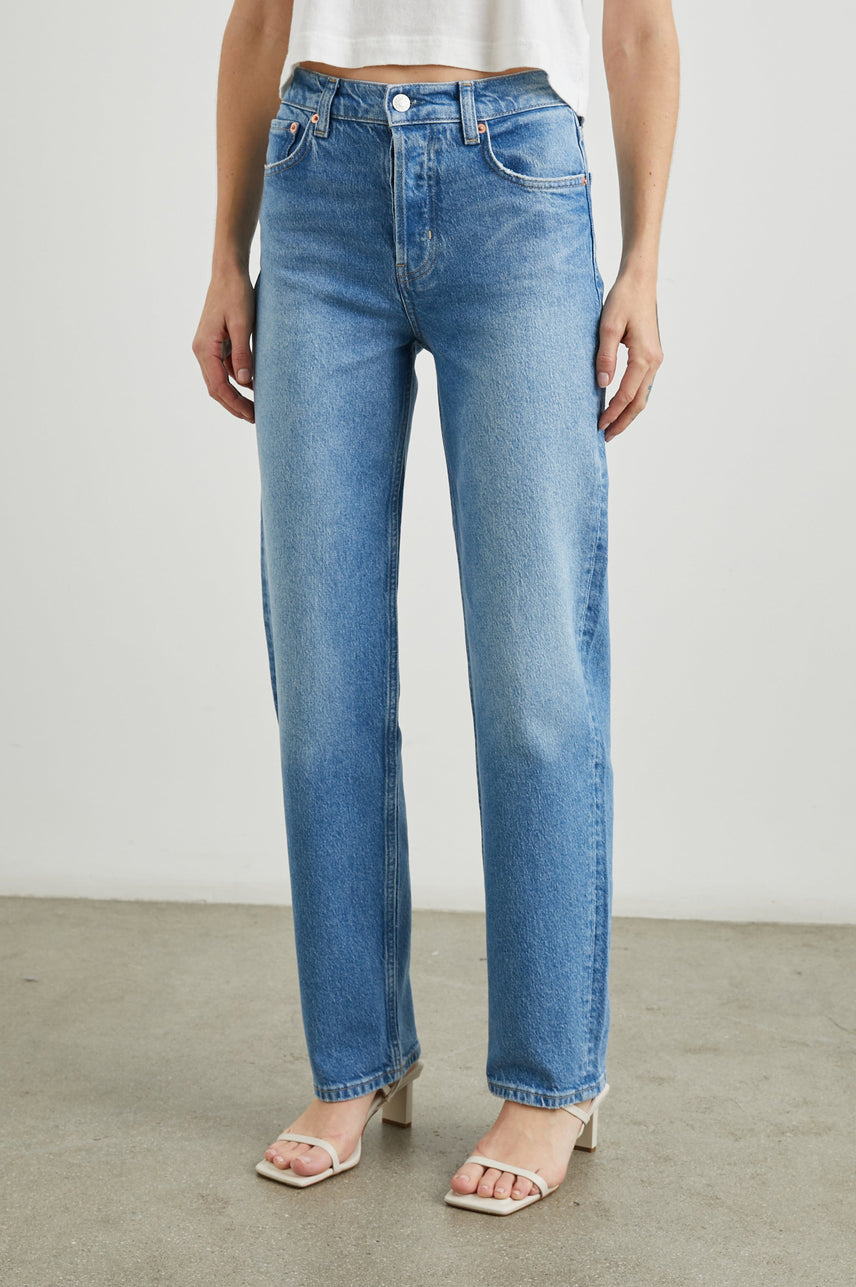 Topanga Straight Jeans with Belt Loops, Two Front Pockets plus a Coin Pocket and Two Back Patch Pockets in Baja Blue Colorway - Front View Featured on Model
