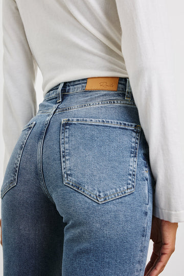 Topanga Straight Jeans with Belt Loops, Two Front Pockets plus a Coin Pocket and Two Back Patch Pockets in Blue Stone Colorway - Back View Featured on Model