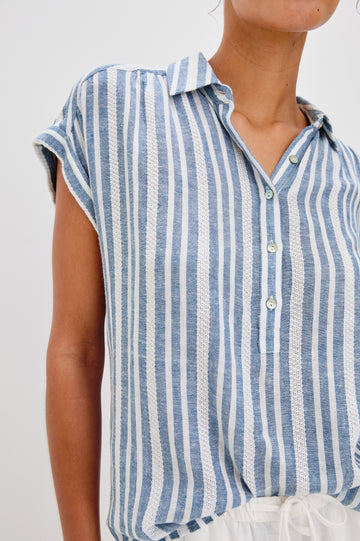 Tuscany Collared Half Button Front Shirt with Rolled Cuff Short Sleeves in Blue and White Jalisco Stripe Colorway. Front Detailed View Shown on Model.