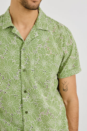 Tyler Collared Button Front Shirt with Short Sleeves and a Chest Pocket in Green White Sunflower Colorway. Front Detail View Shown on Model.