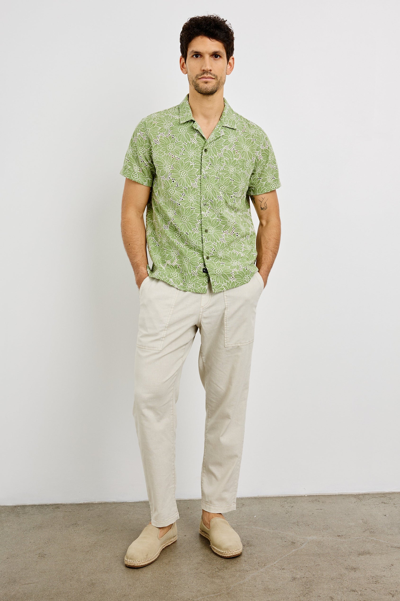 Tyler Collared Button Front Shirt with Short Sleeves and a Chest Pocket in Green White Sunflower Colorway. Front View Shown on Model.