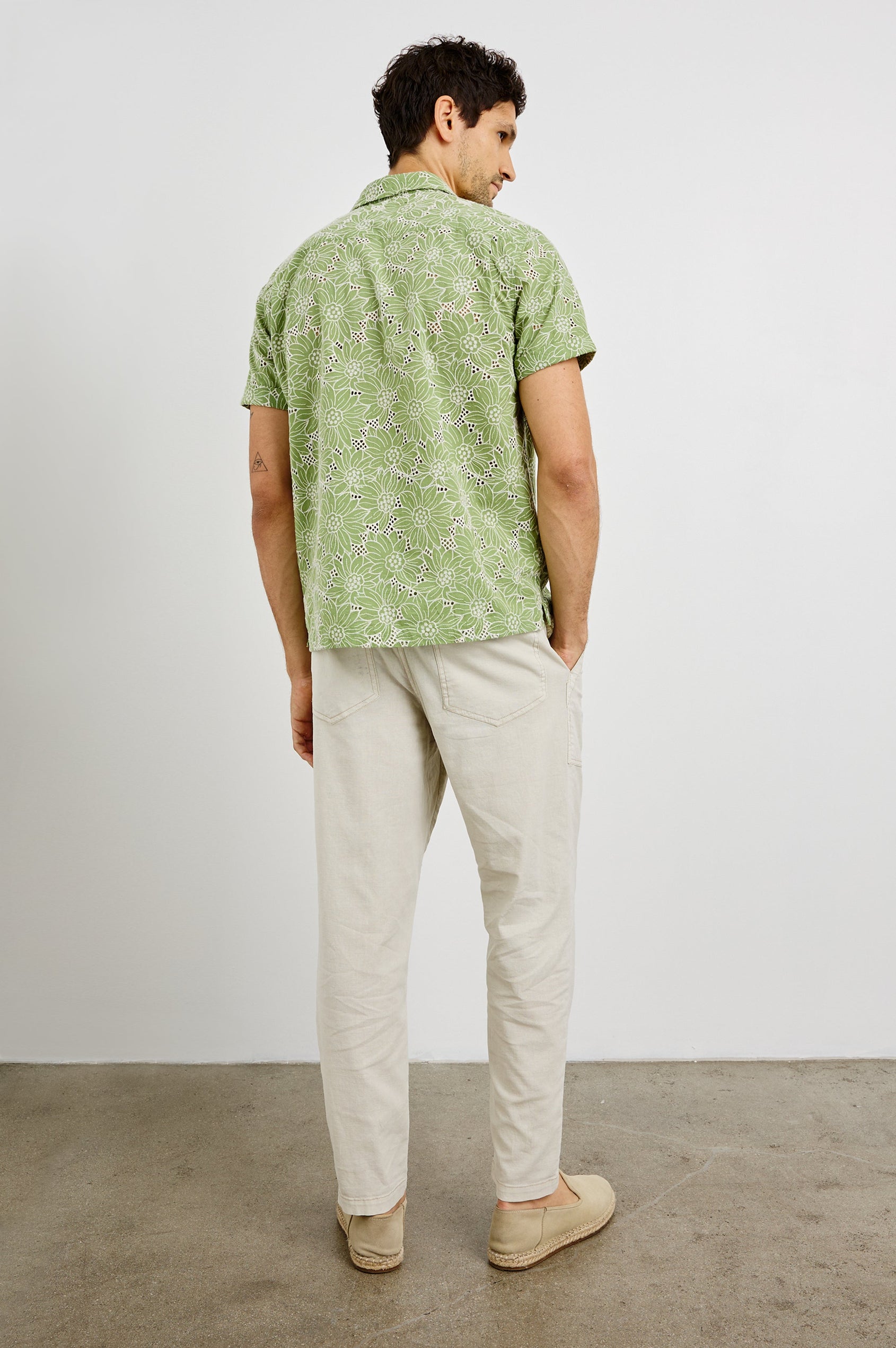 Tyler Collared Button Front Shirt with Short Sleeves and a Chest Pocket in Green White Sunflower Colorway. Back View Shown on Model.