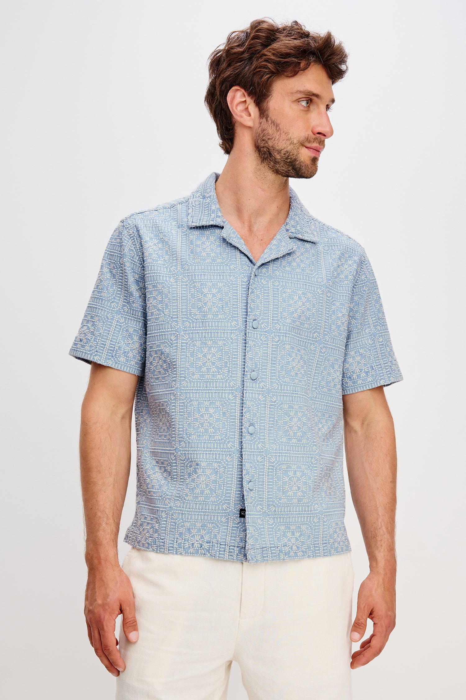 Tyler Shirt in Stretch Cotton With Floral Jute Embroidery, Front Buttons, Notched Collar, Short Sleeves, and Classic Fit in Indigo Cream Squares Colorway - Upper Body Front View Featured on Model