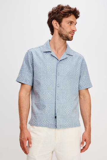 Tyler embroidered short sleeve button up with collar in Indigo Cream Squares colorway - front view featured on model