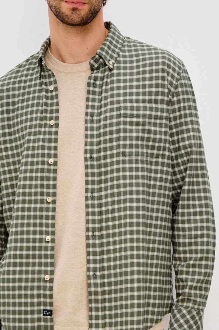 Vance button front collared shirt with long sleeves, collard stand buttons and a single chest pocket in Basil Stone colorway. Front detail view featured on model.