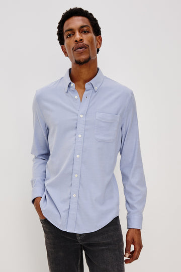 Vance button front collared shirt with long sleeves, collard stand buttons and a single chest pocket in Blue Oxford colorway. Front view shown on model.