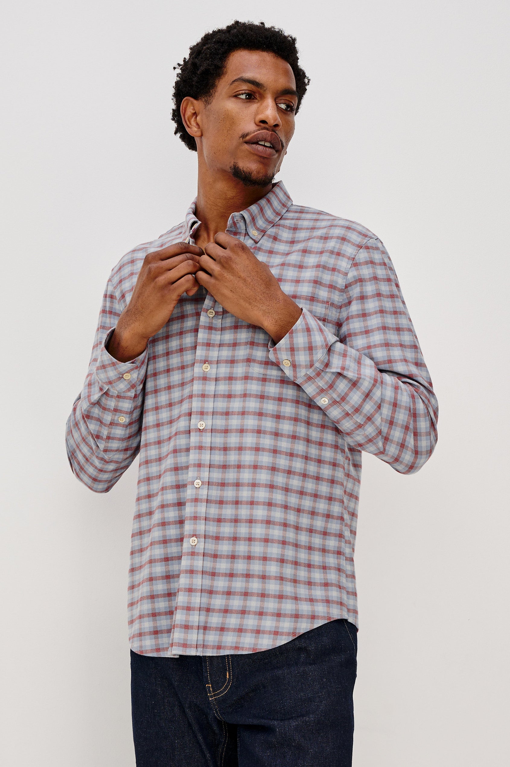 Vance button front collared shirt with long sleeves, collard stand buttons and a single chest pocket in Blue Ruby Check colorway. Front view featured on model.