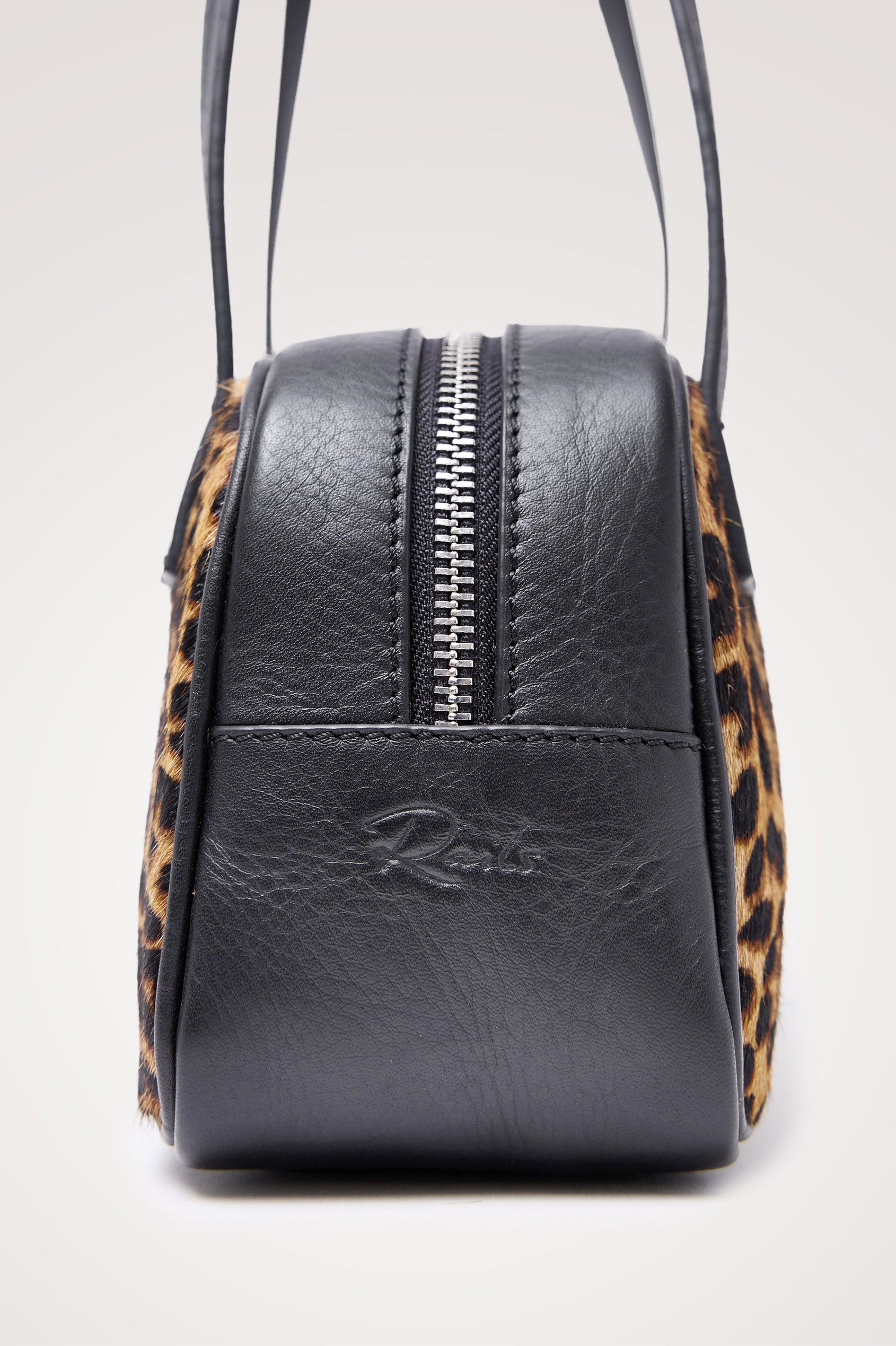 Varese Baguette Bag in Leather and Haircalf With Top Straps, Top-Zip Closure, and Interior Slip Pocket in Brown Nala Hair Calf Colorway - Side Close Up Product View Featured