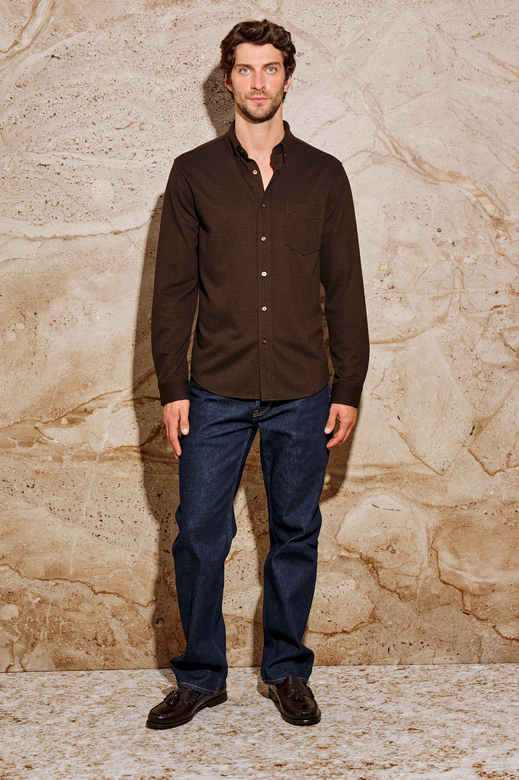 Vincent is a collared long sleeve button front shirt with a chest pocket in Espresso colorway. Front full body view featured on model.