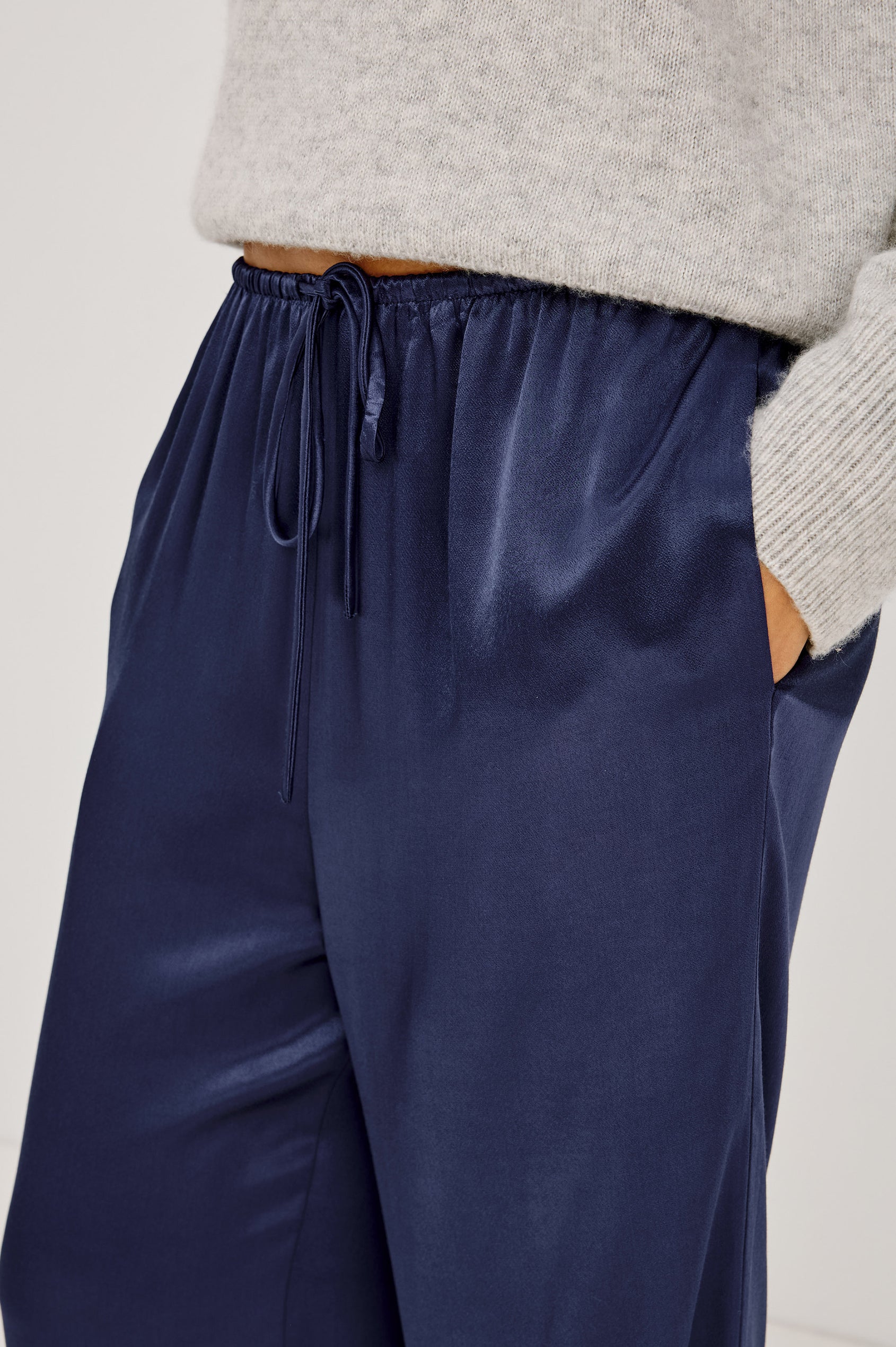 Virgo Pant in Satin-Back Crepe With Srtaight Legs, Drawstring Waist, and Side-Seam Pockets in Navy Colorway - Lower Body Close Up View Featured on Model