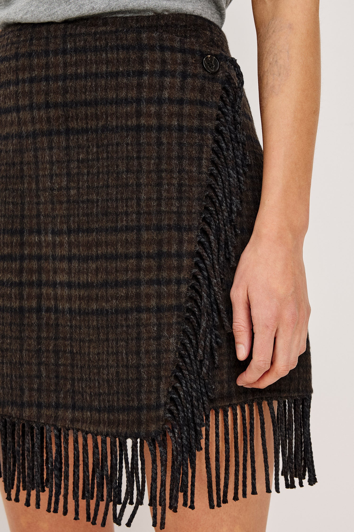 Vista Skirt in Wool Blend With High Waist, Wrap Style Front, Side Button Closure, and Fringe Hem in Highland Plaid Colorway - Lower Body Front View Featured on Model