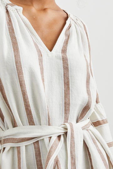 Vittoria Midi Dress with Three-Quarter Sleeves, a V Neck, Light Ruching at the Collar, and a Fabric Tie Belt in Coconut Stripe Colorway, Coconut Vertical Stripes on White with Horizontal Stripes at the Hem - Front View Featured on Model
