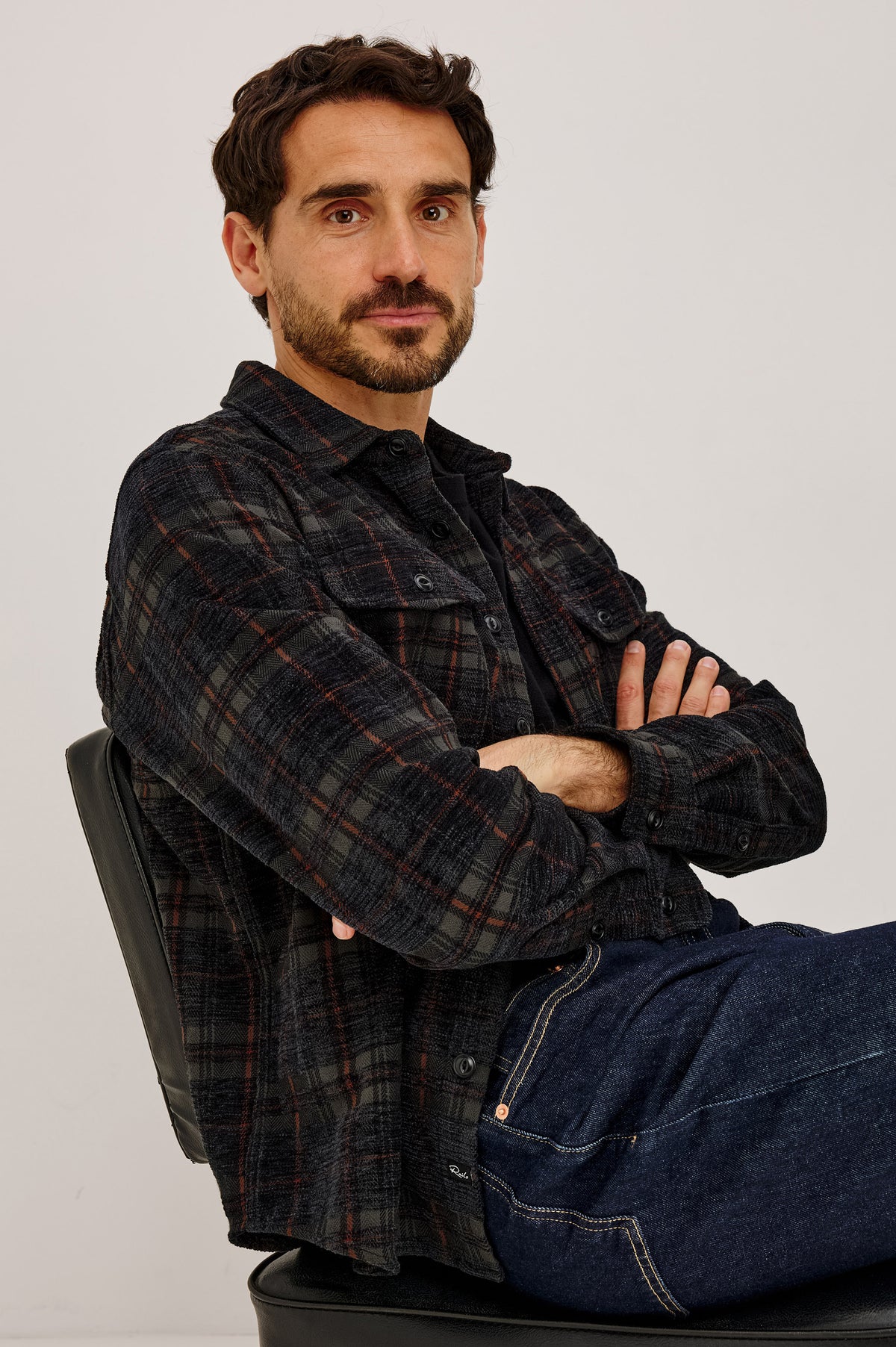 Warren Overshirt in Textured Chenille Cotton Blend With Collar, Button Front, and Dual Chest Flap Pockets in Black Smoke Ember Colorway - Front View Featured on Model.