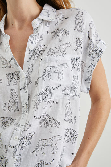 Whitney Short Rolled Sleeves Button Up with a Chest Patch Pocket and Short Side Slits in Ivory Jungle Cats Colorway, with black jungle cats on ivory - Front View Featured on Model