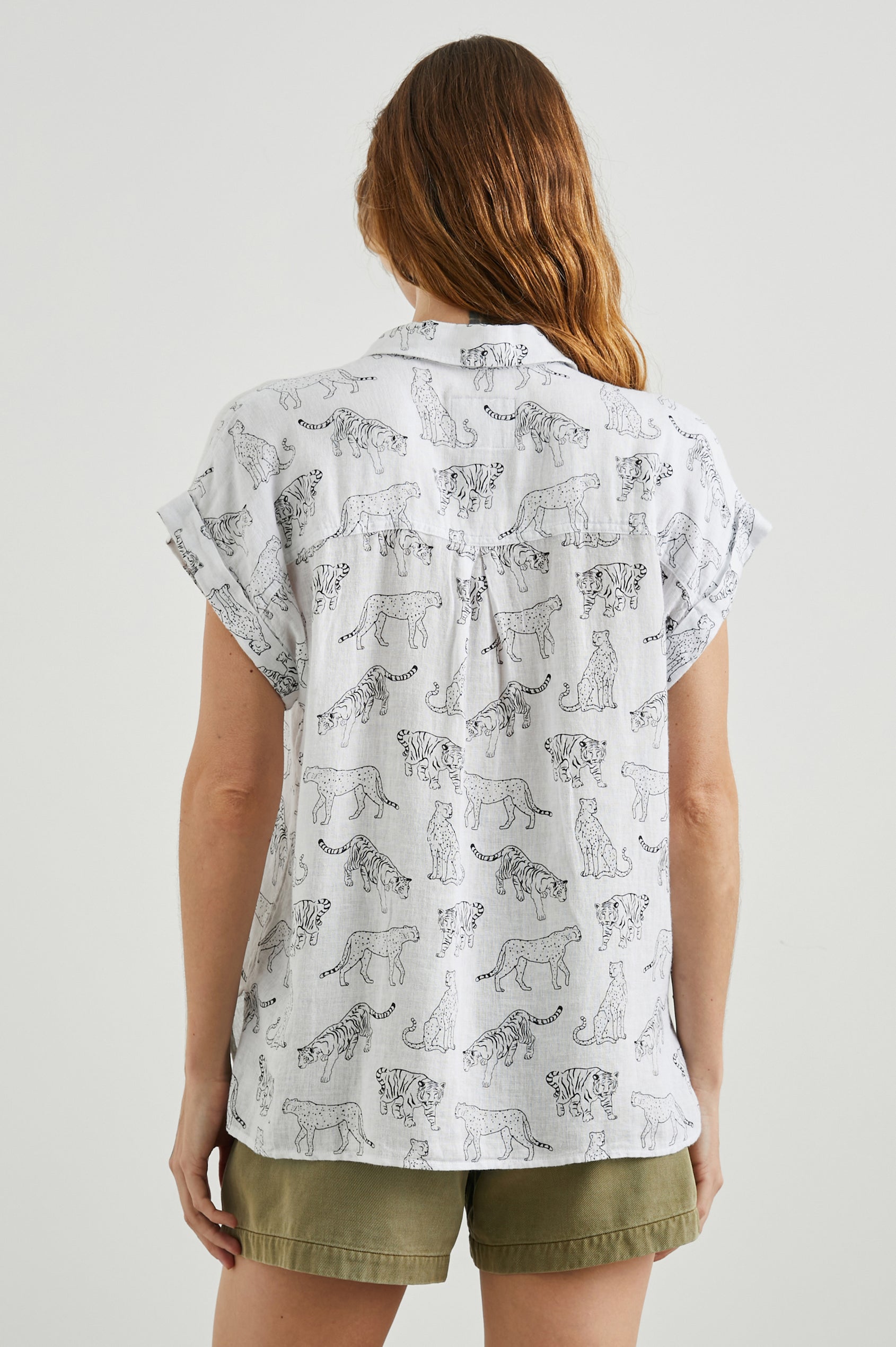 Whitney Short Rolled Sleeves Button Up with a Chest Patch Pocket and Short Side Slits in Ivory Jungle Cats Colorway, with black jungle cats on ivory - Back View Featured on Model