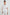 Whitney Short Rolled Sleeves Button Up with a Chest Patch Pocket and Short Side Slits in White Colorway - Front View Featured on Model