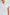 Whitney Short Rolled Sleeves Button Up with a Chest Patch Pocket and Short Side Slits in White Colorway - Front View Featured on Model