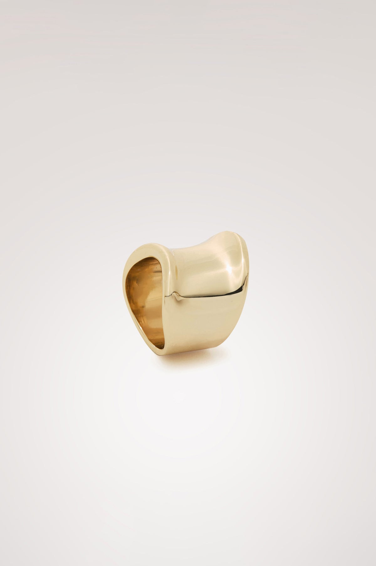 Curved Ring Gold-Toned With Wide Band and Engraved Rails Logo at Interior in Gold Colorway - Side View Featured