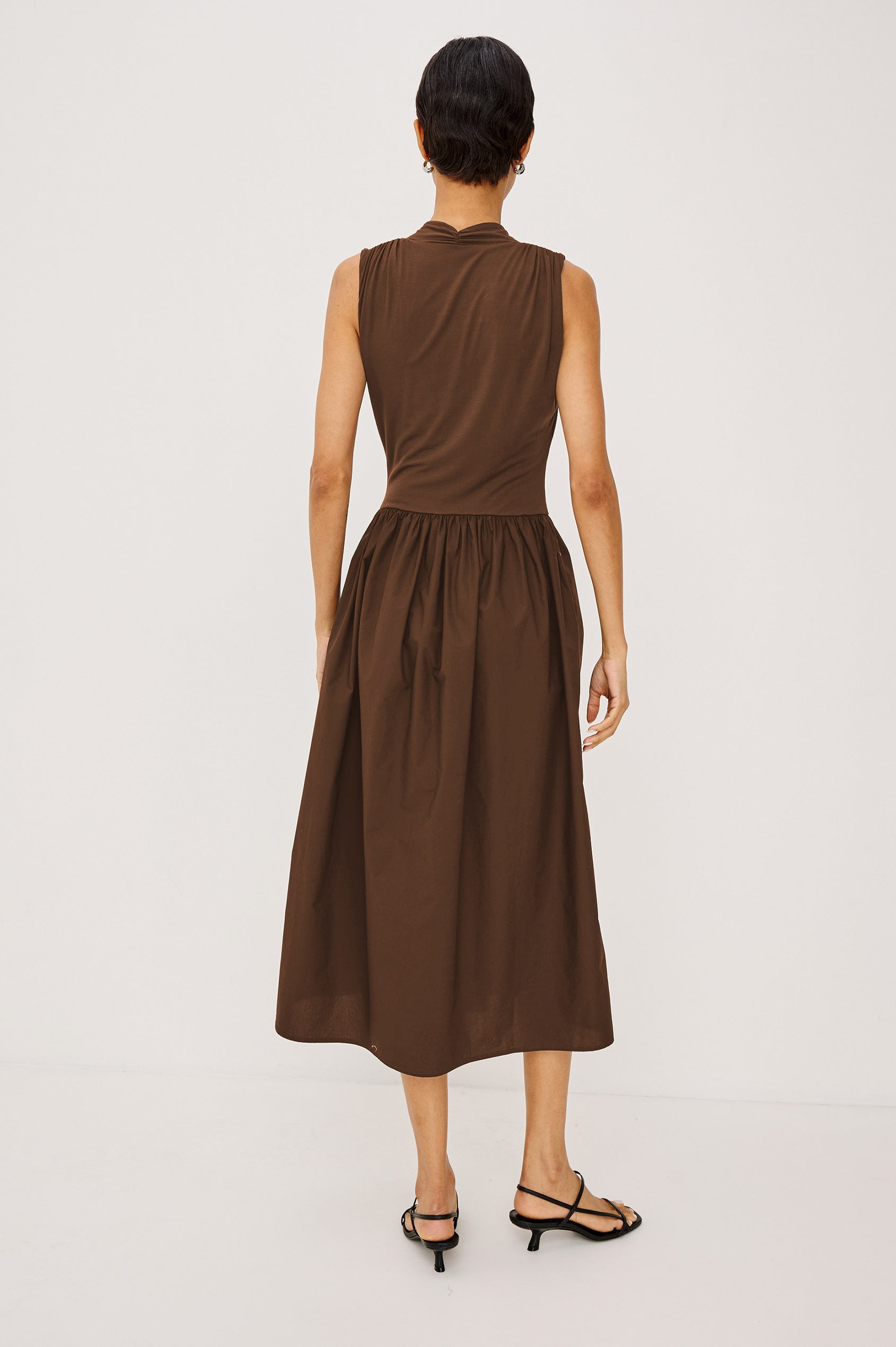 Veda Maxi Dress in Self-Lined Mesh With Sleeveless Cut, Full Lining, Ruffle V-Neckline, Ruched Bodice, and A-Line Skirt in Dark Flora Colorway - Full Body Front View Featured on Model