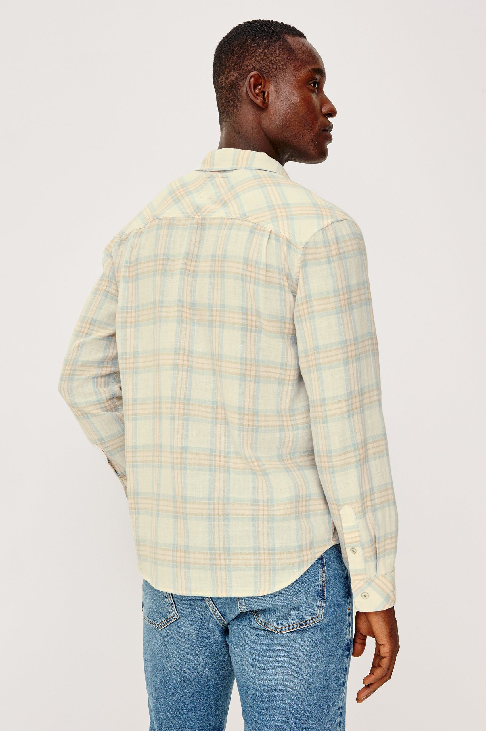 Wyatt Button Front Collared Shirt With Long Sleeves and Single Chest Pocket in Conch Shore Colorway - Upper Body Back View Featured on Model