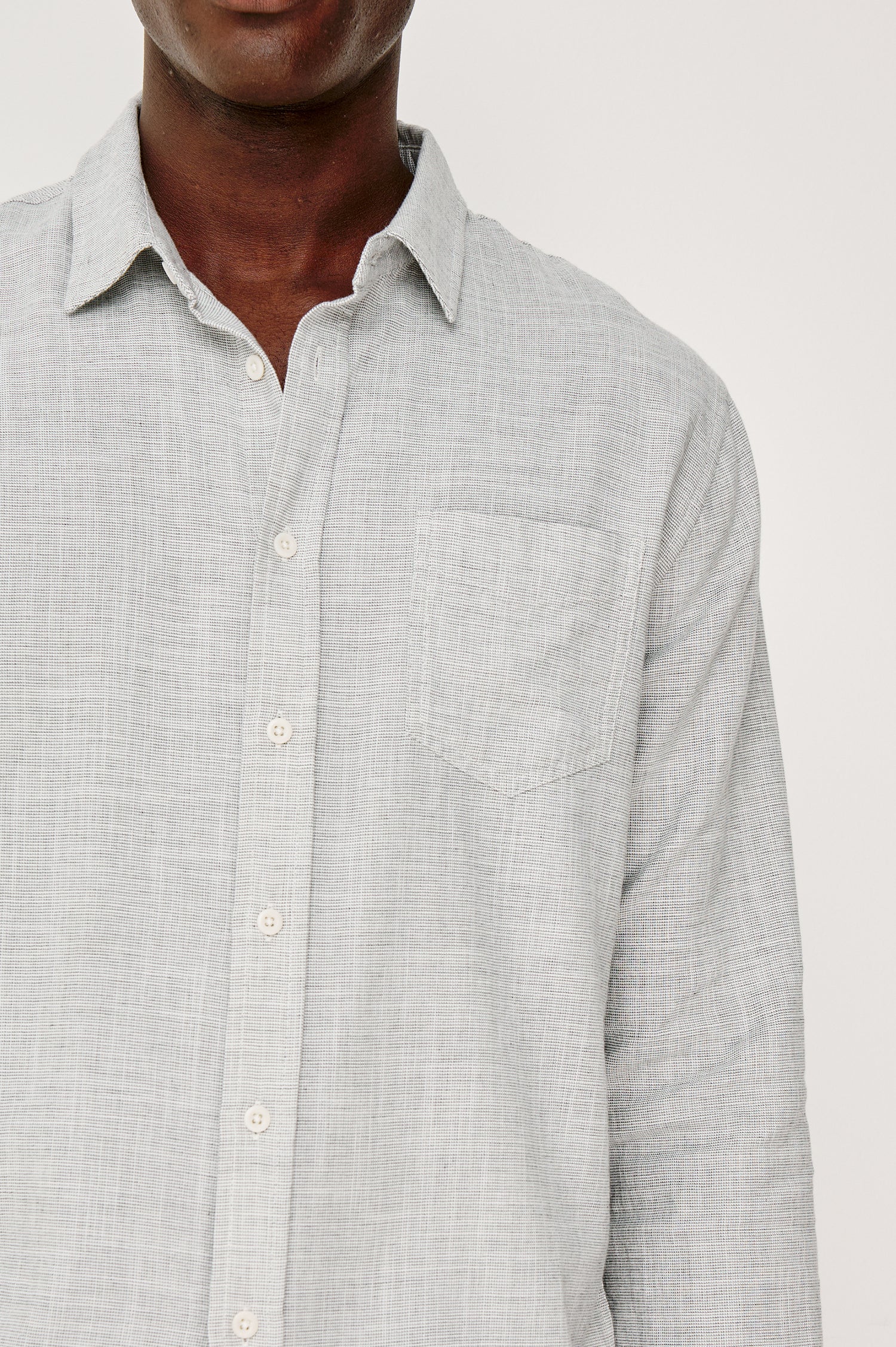 Wyatt Button Front Collared Shirt With Long Sleeves and Single Chest Pocket in Platinum Etch Colorway - Upper Body Front Detail View Featured on Model
