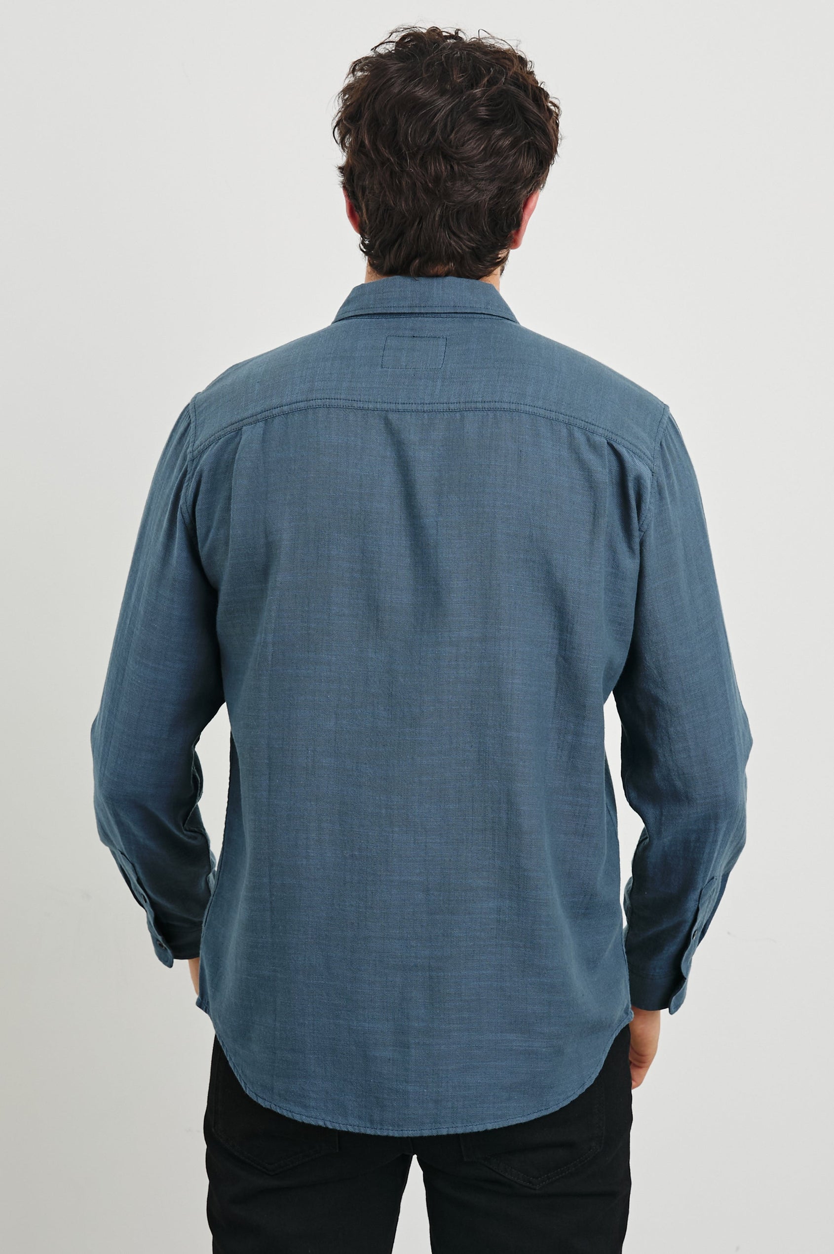 Wyatt Long-Sleeve Button Up with a Chest Patch Pocket in Sea Blue Colorway - Back View Featured on Model