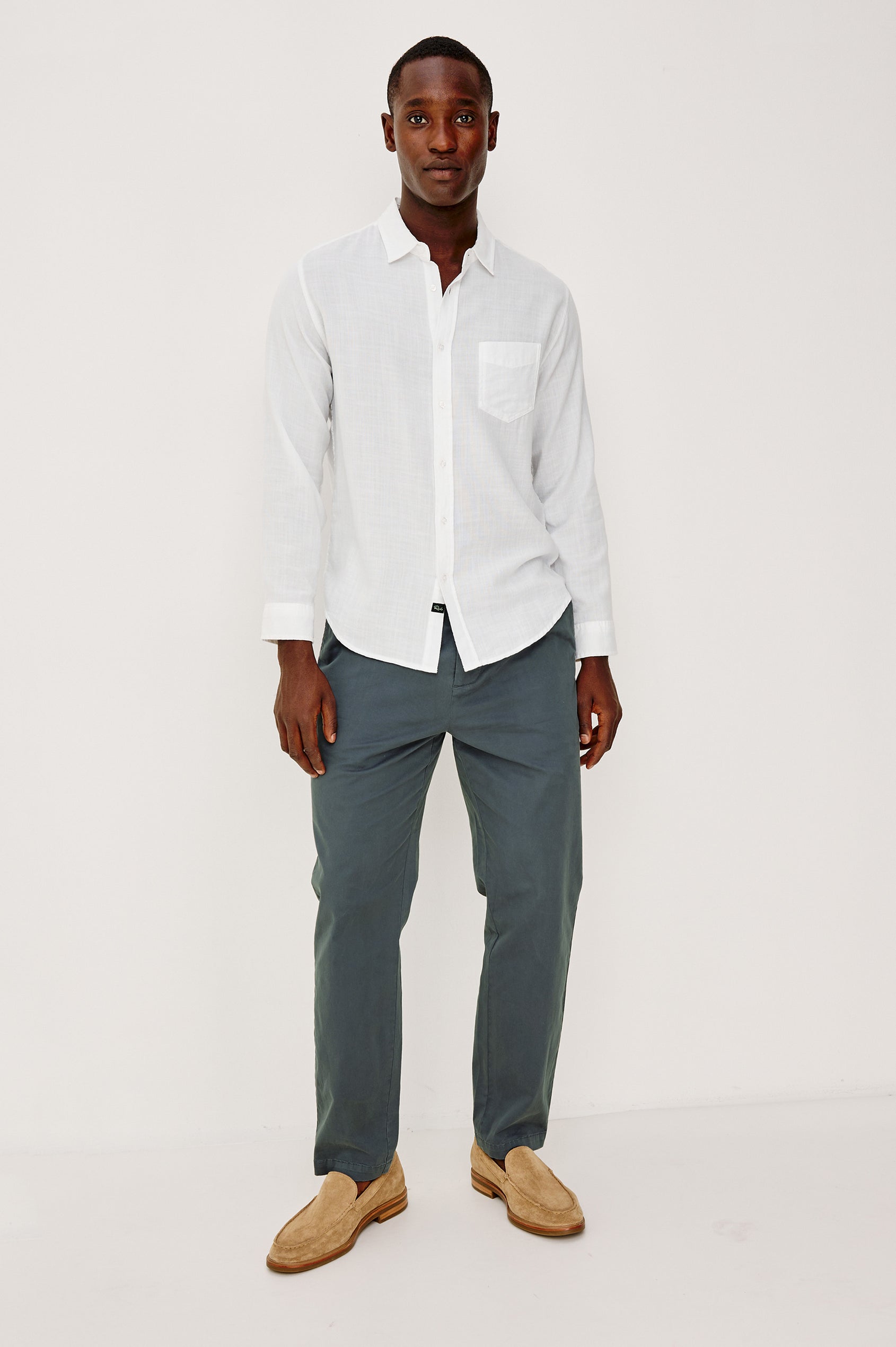 Wyatt Button Front Collared Shirt With Long Sleeves and Single Chest Pocket in White Colorway - Full Body Front View Featured on Model
