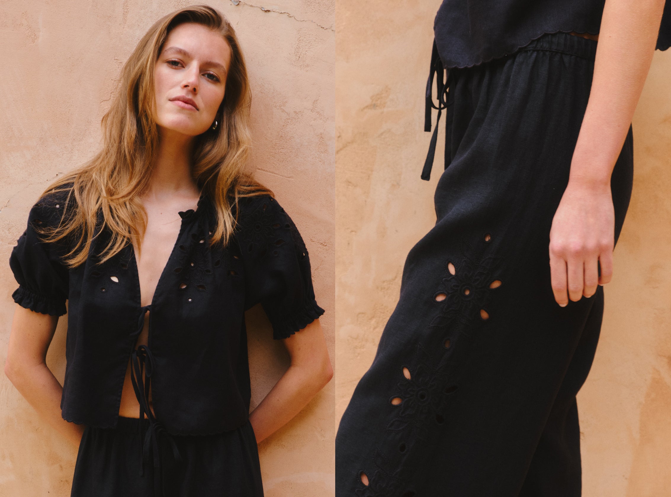 Woman wearing a black outfit with cut-out details against a beige wall.