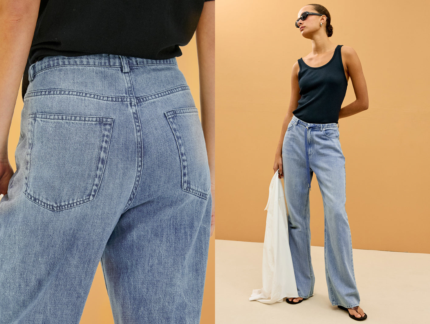 Woman wearing light blue jeans with a plain background