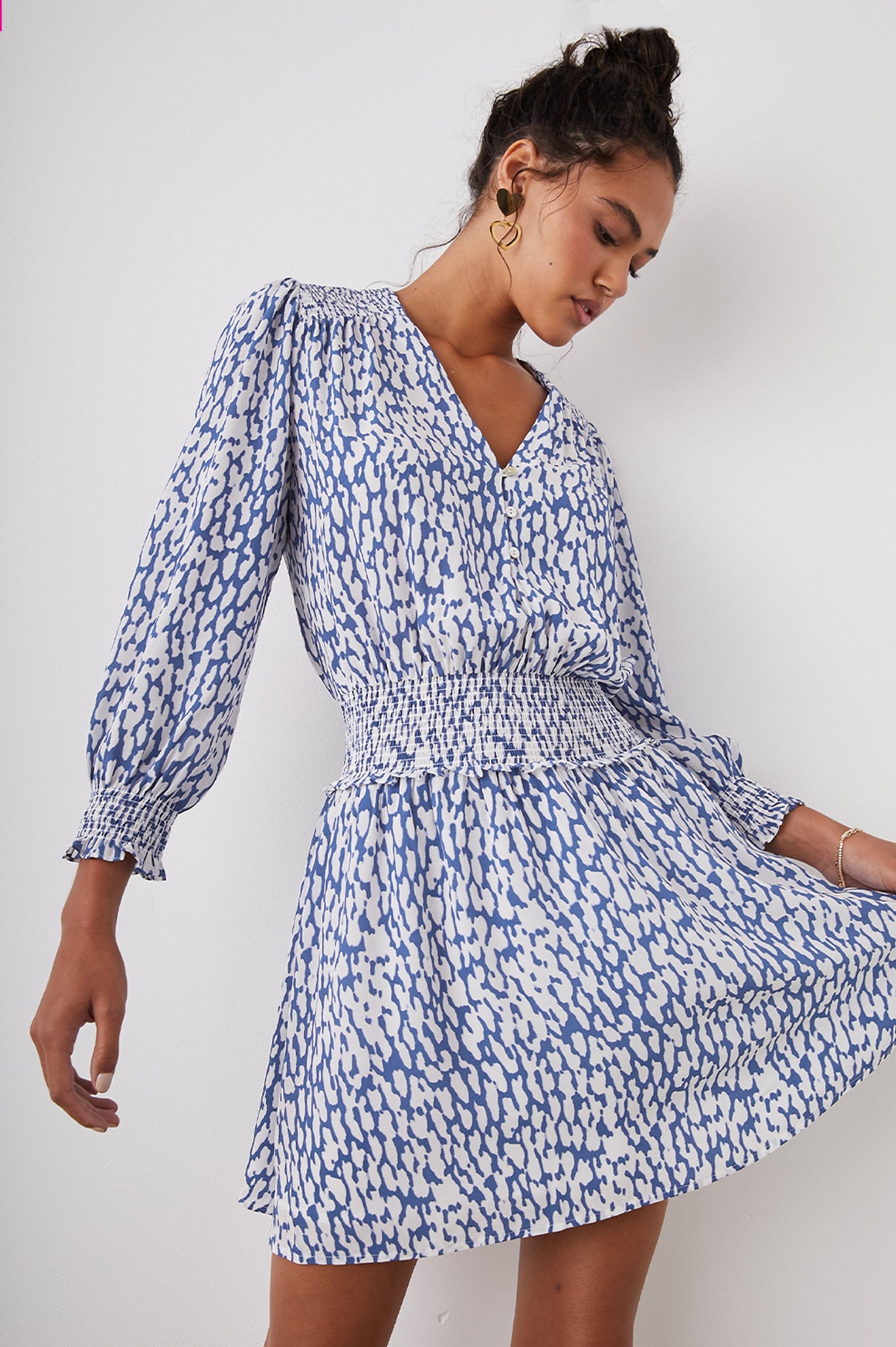 Zana Long-Sleeve Mini Dress with a V Neck, Smocked Cuffs and Waist, and Buttons Down the Bodice in Cobalt Static Leopard Colorway, a White and Cobalt Spotted Print - Front View Featured on Model