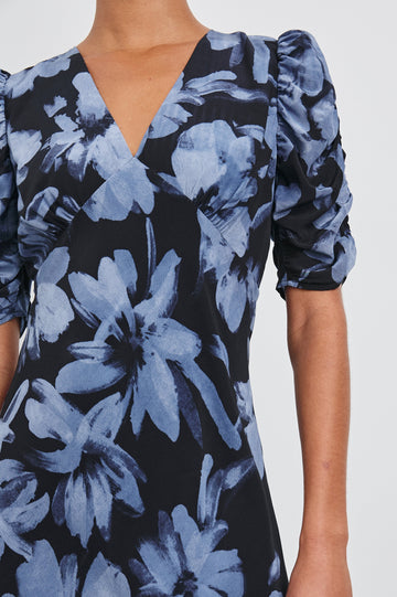 Zariah Midi Dress with Mid-Length Sleeves with Light Ruching, a Deep V Neck and an Empire Waist in Midnight Lily Colorway, with flowers in blues on midnight - Front  View Featured on Model