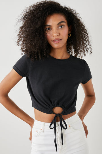 Zena Short-Sleeve Cropped T-Shirt with a Crew Neck and a Circular Cutout with a Tie at the Front Hem in Black Colorway - Front View Featured on Model 