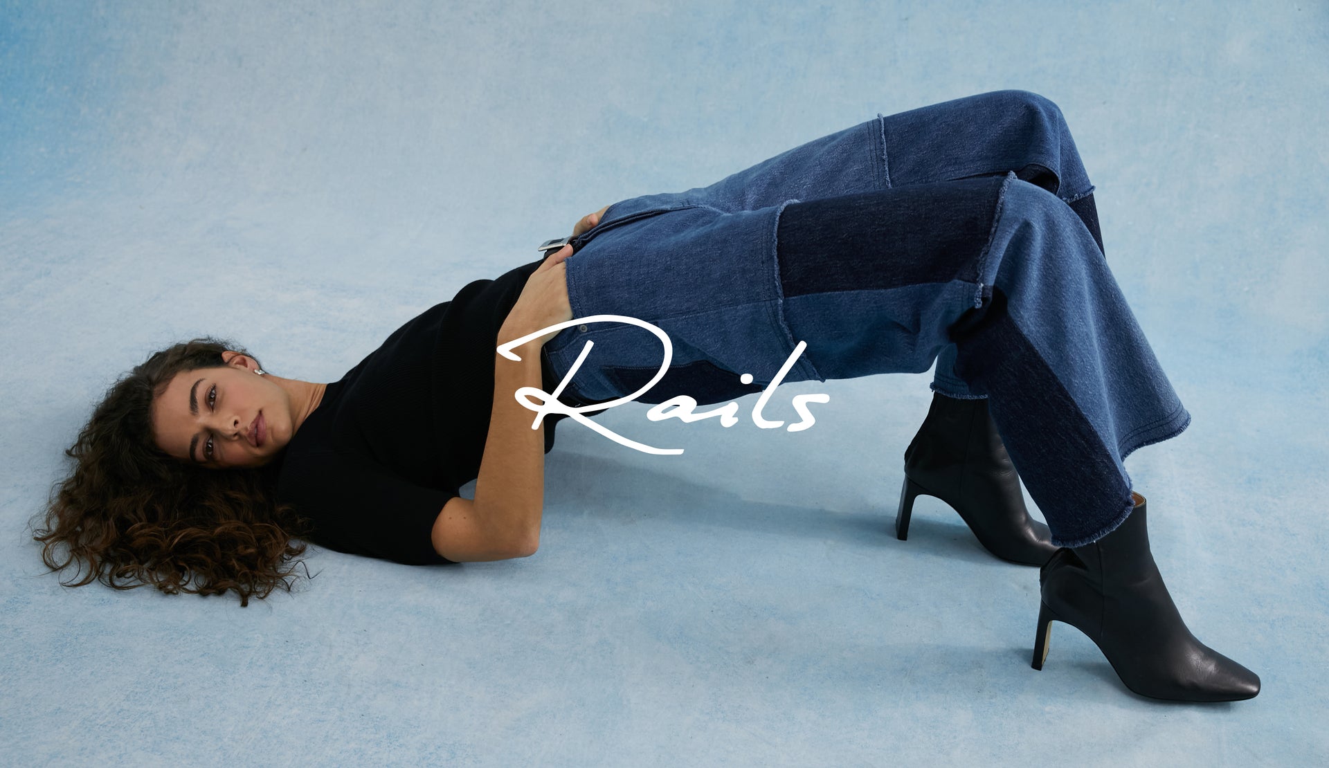 EDITORIAL IMAGE OF MODEL WEARING GETTY CROP WIDE LEG JEANS AND INDIGO PATCHWORK