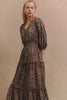 (Video): Model walking in the Caterine dress in Brown Nala animal print, showing the drape of the fabric and the long-sleeve fit.