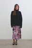 (video) Sanna Long Sleeve Knit Sweater with a Funnel Neck and Slits at the Back of the Neck and on the Cuffs in Dark Slate Colorway - Full body Front View Featured on Model