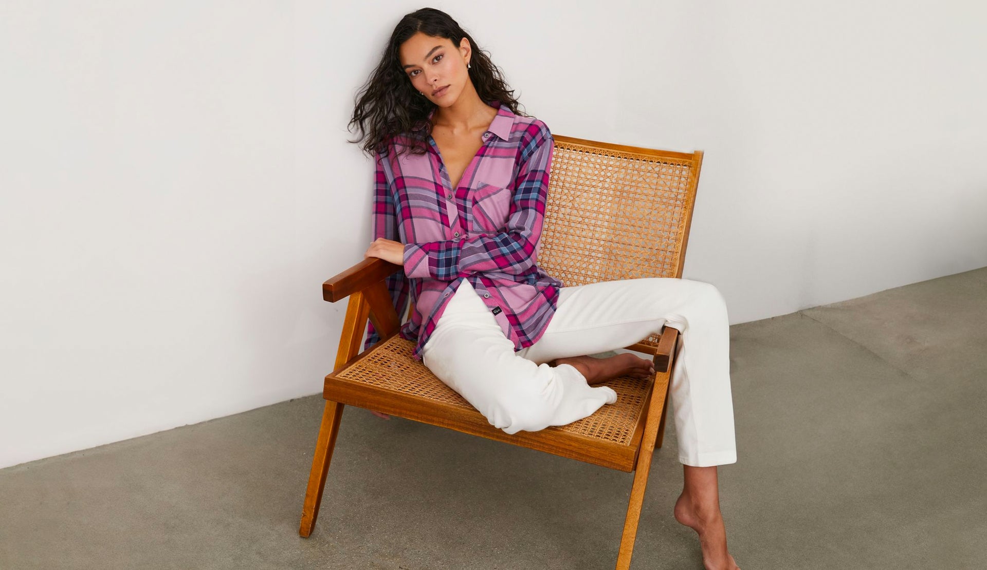 EDITORIAL IMAGE OF MODEL SITTING WEARING HUNTER SHIRT