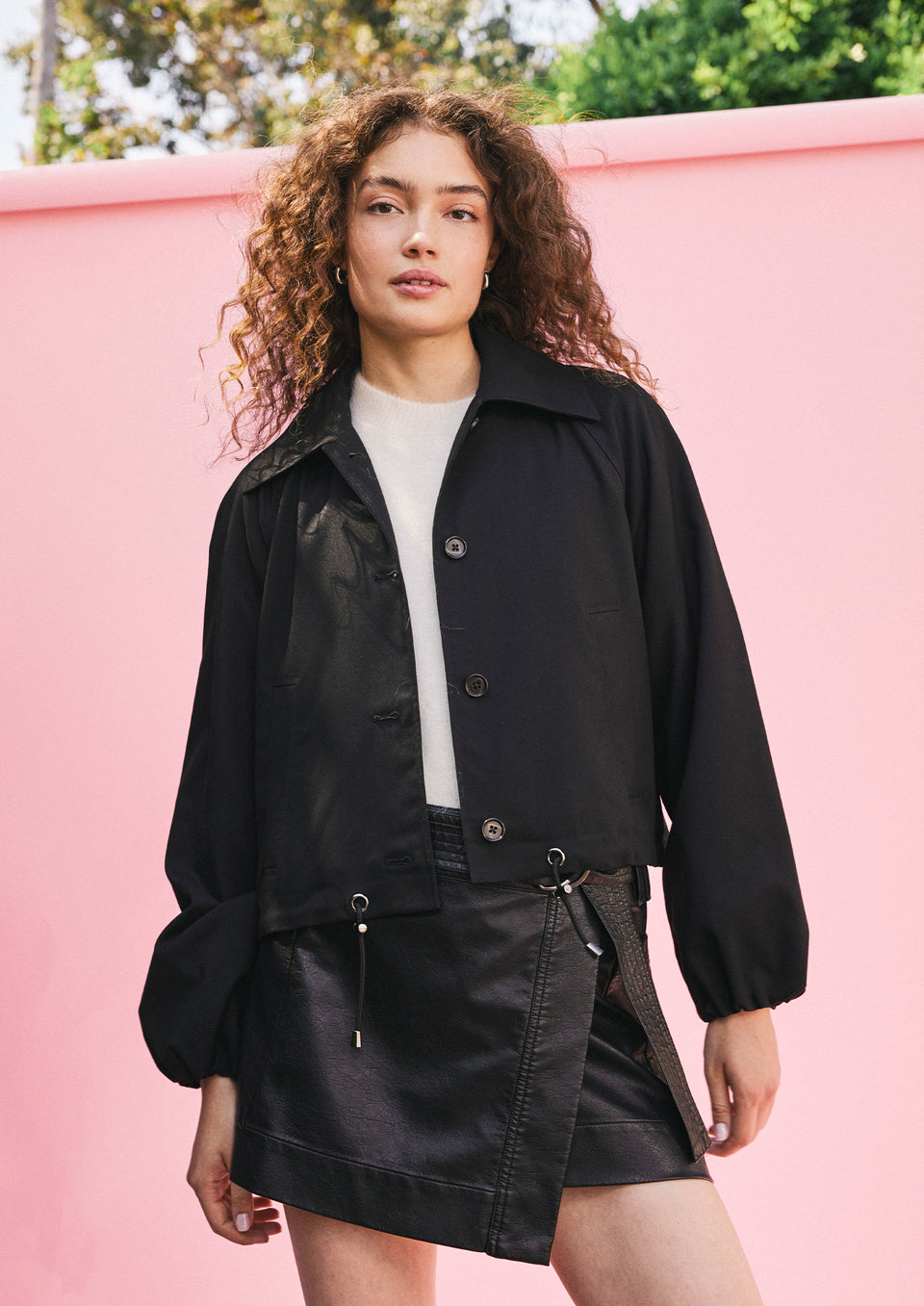 FRONT EDITORIAL IMAGE OF MODEL WEARING NORTH JACKET, BRIAR TOP, AND ADRIANA SKIRT