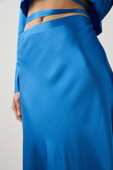 Anya High-waisted Midi Skirt in Cobalt Colorway - Side View Featured on Model