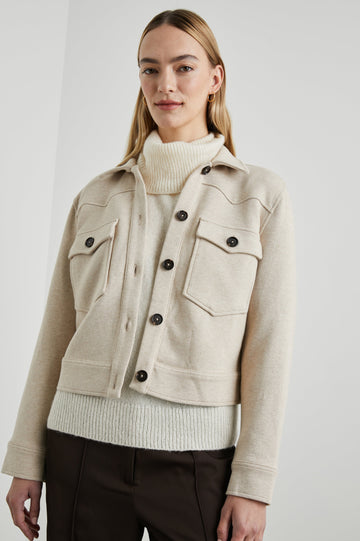 Easton Slightly Cropped Jacket with Button Closure, Two Chest Button Flap Pockets and Western Yokes in Heather Oatmeal Colorway - Front View Featured on Model