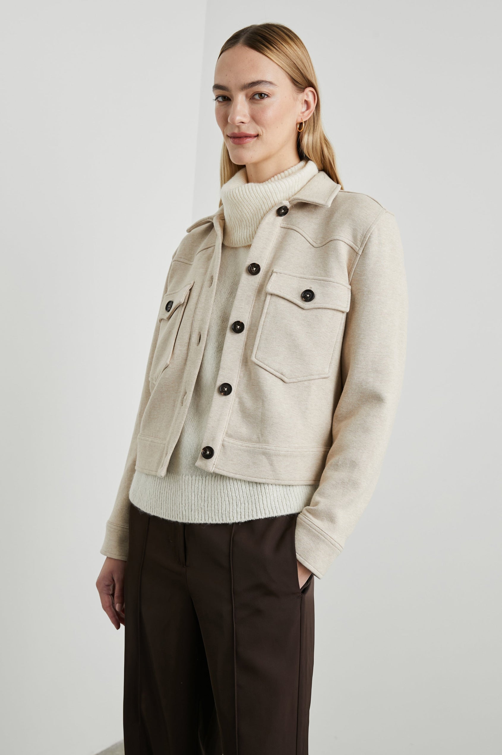 Easton Slightly Cropped Jacket with Button Closure, Two Chest Button Flap Pockets and Western Yokes in Heather Oatmeal Colorway - Front View Featured on Model