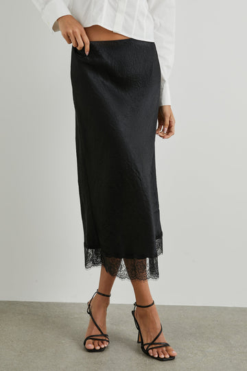 Ebony Midi Skirt with Lace Trim in Black Colorway - Front View Featured on Model 