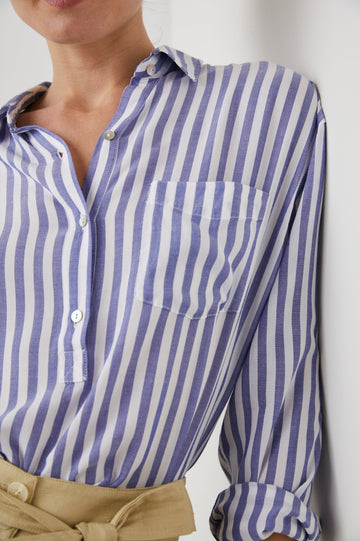 Elle Long Sleeve Shirt with a Four Button Placket, Buttoned Cuffs, a Chest Pocket and a Collar in Blue White Stripe Colorway, Vertical Stripes - Front View Featured on Model