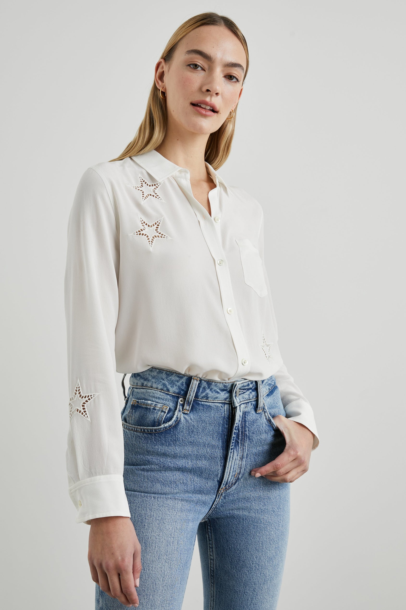 Kate Long Sleeve Button up with a Chest Patch Pocket and Eyelet Stars in Ivory Eyelet Stars Colorway  - Front Tucked View Featured on Model