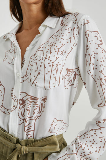 Kathryn Long-Sleeve Button up with a Chest Patch Pocket in Camel Jungle Colorway, with large camel jungle cats on  ivory - Front tucked View Featured on Model