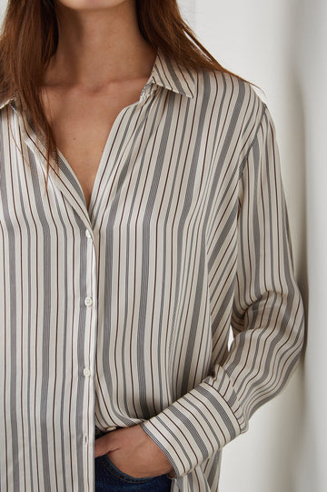 Dorian Long-Sleeve Button Up in Providence Stripe Colorway, Thin Black and Brown Vertical Stripes on Cream  - Front View Featured on Model