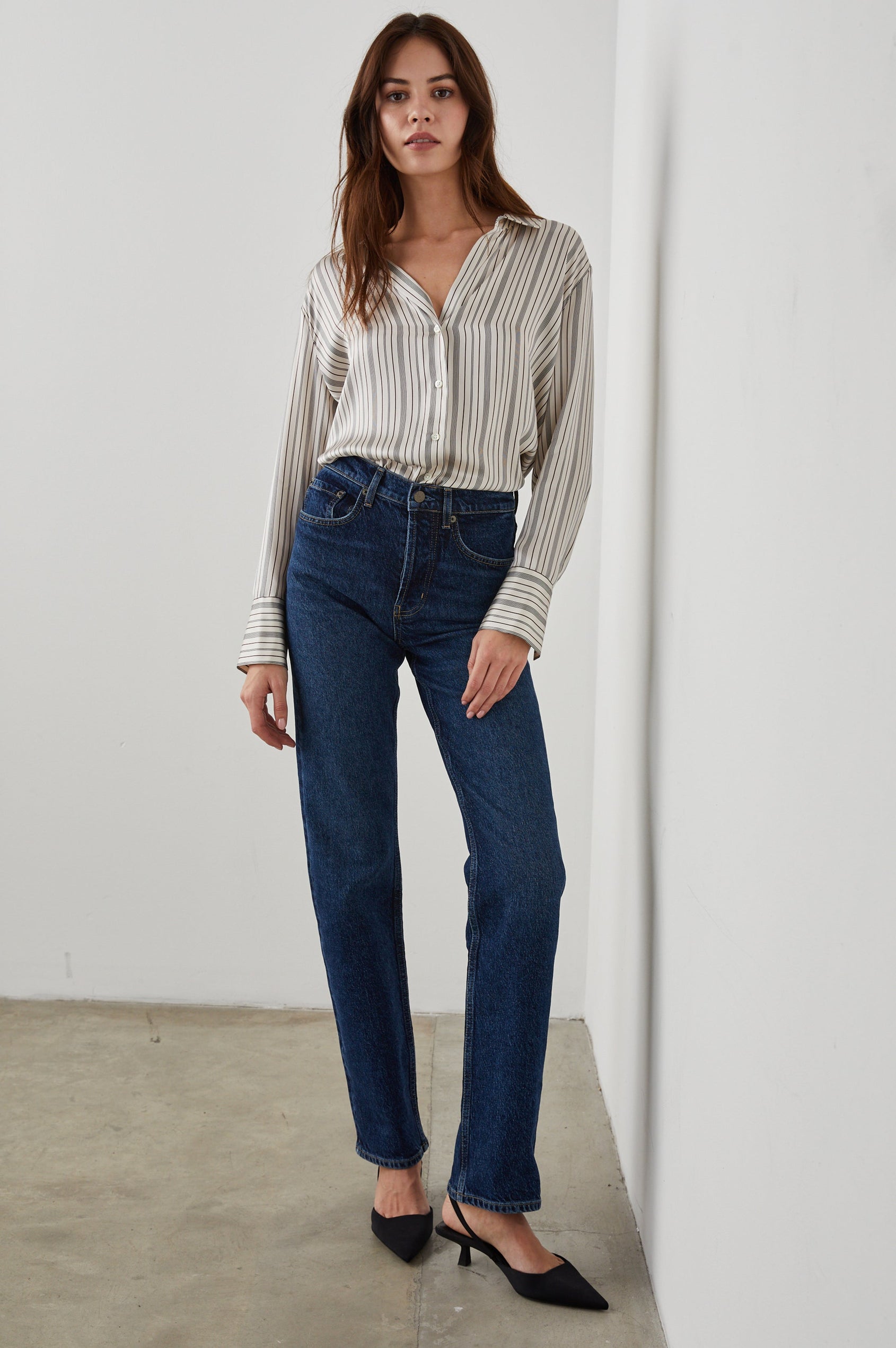 Dorian Long-Sleeve Button Up in Providence Stripe Colorway, Thin Black and Brown Vertical Stripes on Cream  - Front Full Body View Featured on Model