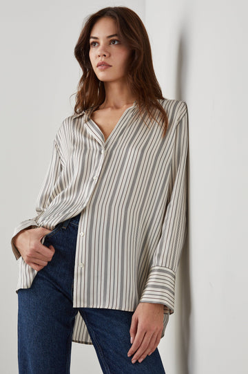 Dorian Long-Sleeve Button Up in Providence Stripe Colorway, Thin Black and Brown Vertical Stripes on Cream  - Front View Featured on Model